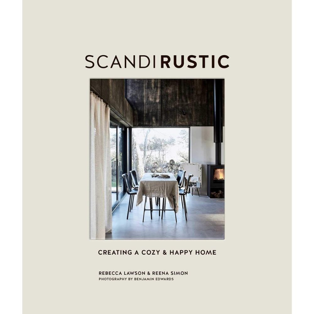 עטיפת הספר "ספר עיצוב scandi rustic" מאת Fine Lab Home, המציגה פינת אוכל מודרנית עם חלונות גדולים, גוונים ניטרליים ועיצוב סקנדינבי מינימליסטי.