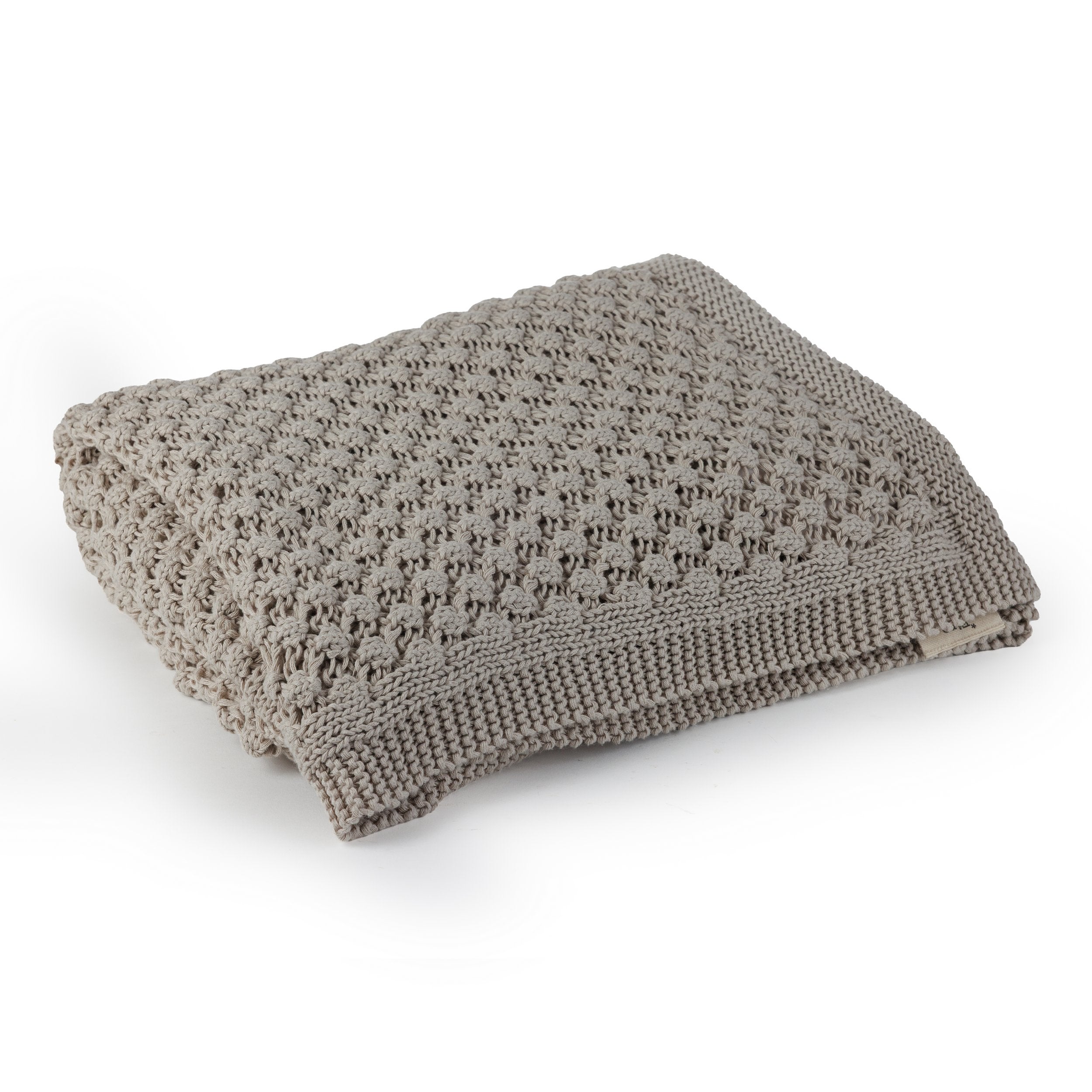 שמיכת הטלוויזיה como dots של Fine Lab Home היא שמיכה סרוגה בצבע בז' עם דוגמה מרקמית וקצוות מצולעים — אידיאלית כשמיכת טלוויזיה סרוגה או שמיכה לסלון לערבים נעימים.