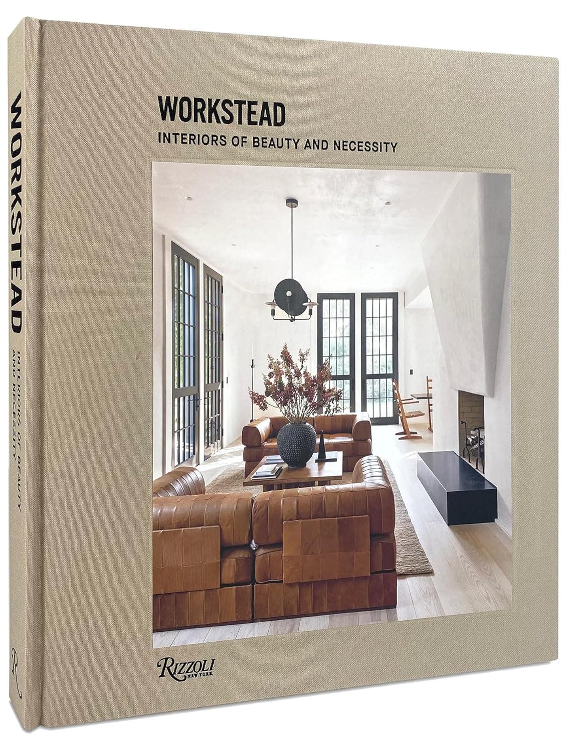 ספר עיצוב workstead מבית Fine Lab Home, עם צילום כריכה של סלון מודרני הכולל ספות חומות, קמין, חלונות גדולים ועיצוב פנים מרהיב של סטודיו Workstead.
